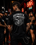 Black Liquid Metal T-shirt, back melting silver skull graphic in a city scene
